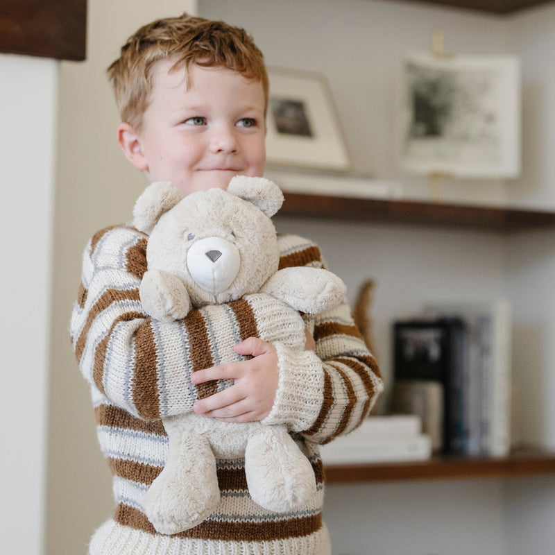 Child hugs Saranoni Stuffed Animal - Bear