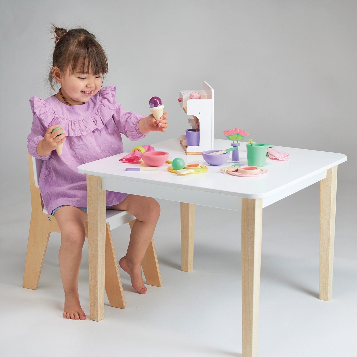 Little girl plays with Mentari Toys Ice Cream Kiosk