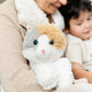 Woman holds Warmies Calico Cat