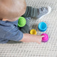 Toddler playing with Fat Brain Toys Dimpl Stack