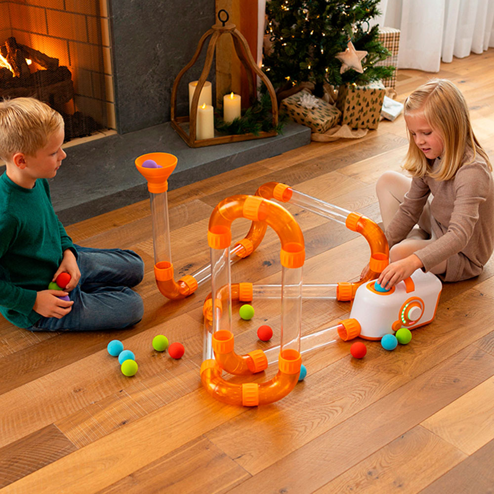 Two kids play with Fat Brain Toys Air Toobz Extension Set