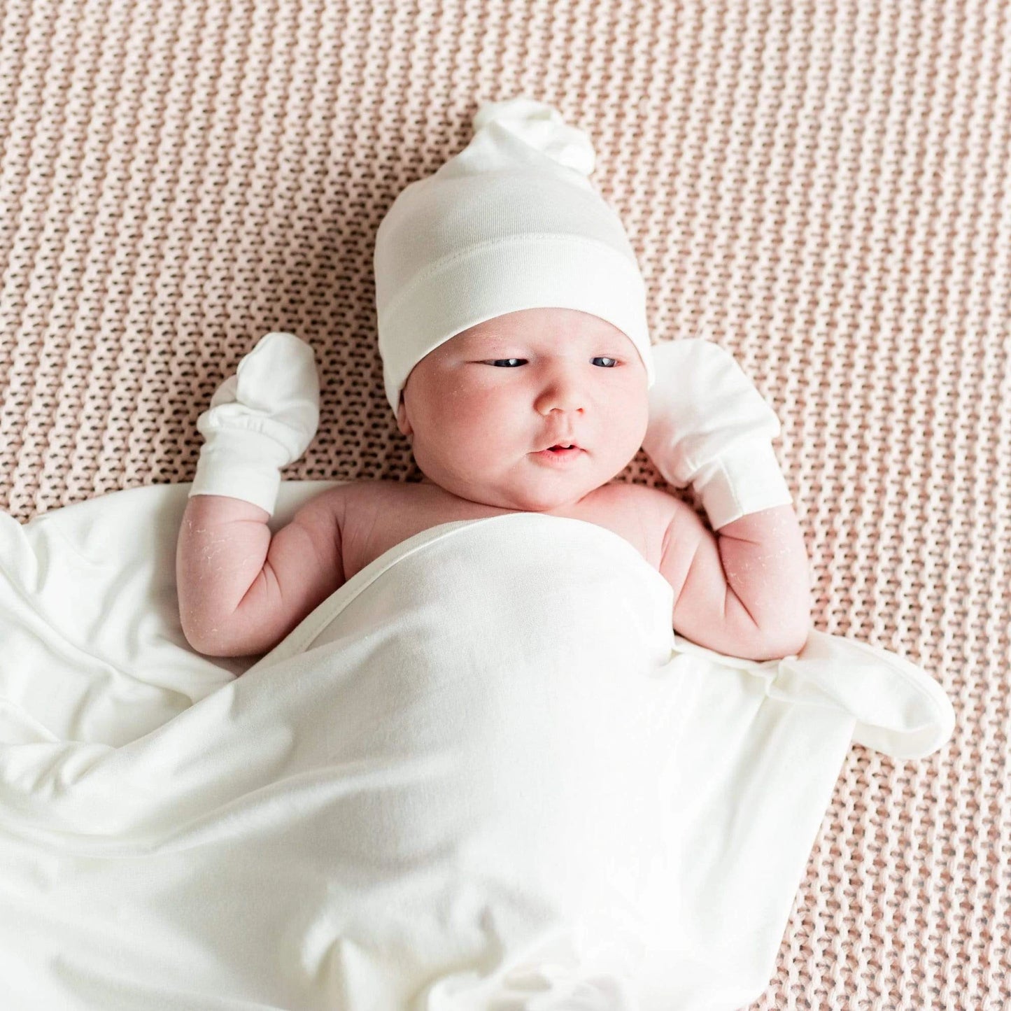 Baby wearing Kyte BABY Knotted Cap - Cloud