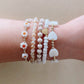 LittleLundsCo Baby Bracelet - Gold Daisy on wrist