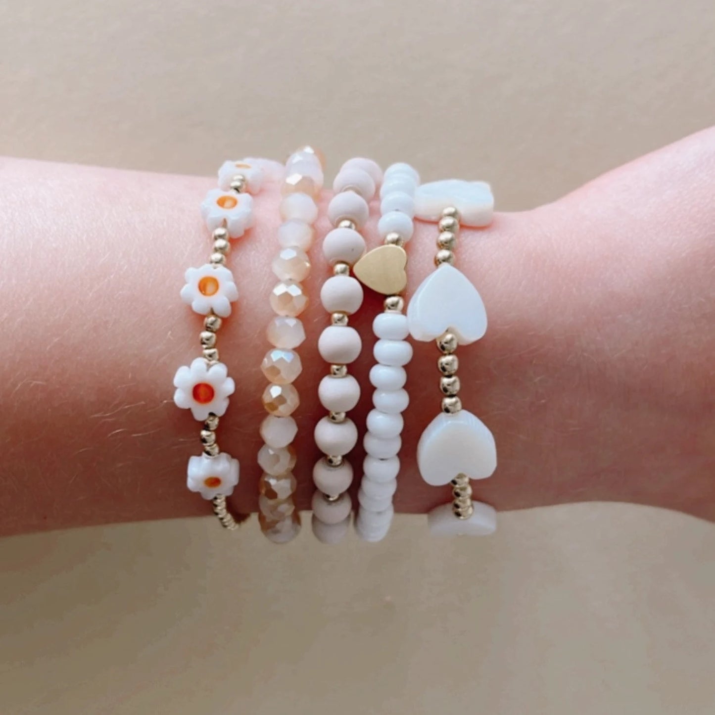 LittleLundsCo Baby Bracelet - Gold Daisy on wrist