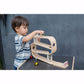Boy plays with PlanToys Ramp Racer