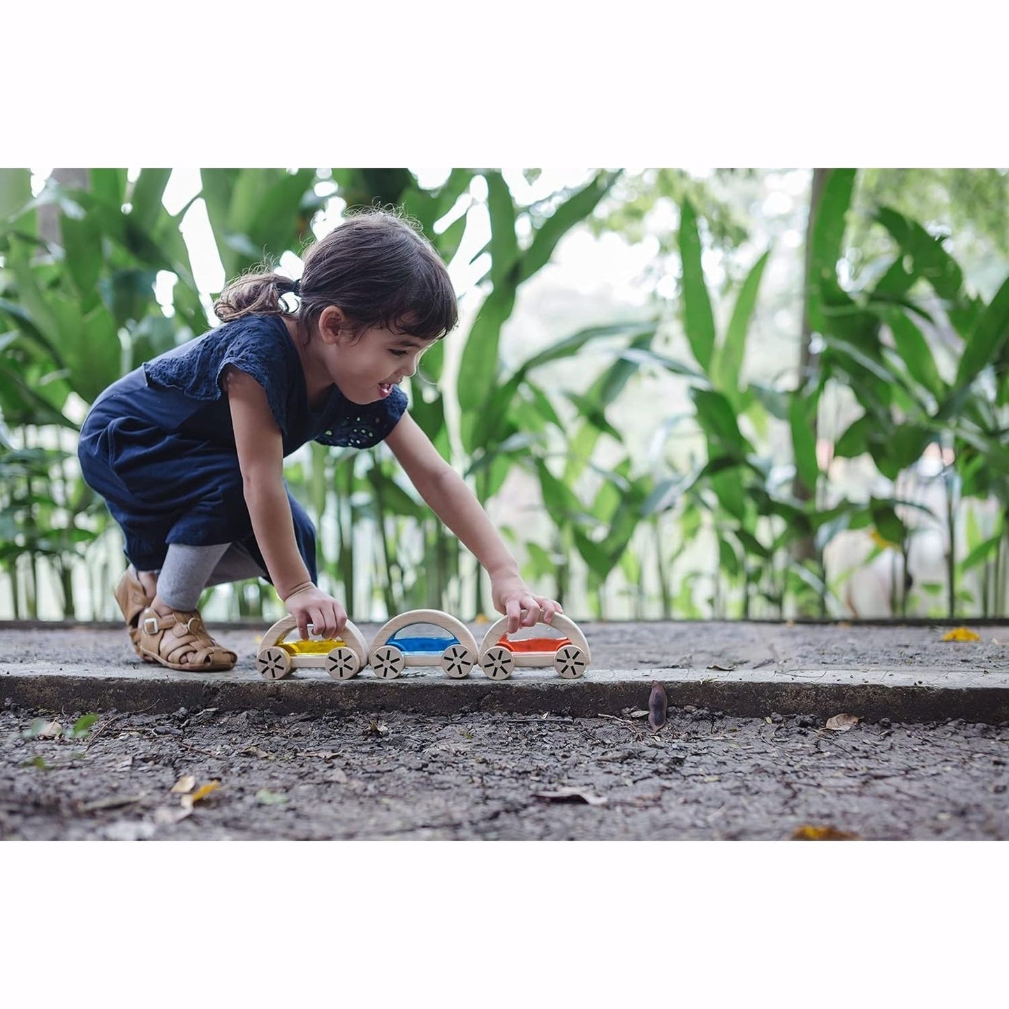 Child  plays with PlanToys Wautomobile