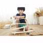 Boy plays with PlanToys Ramp Racer