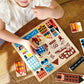 Little girl plays with Mentari Toys Town Puzzle