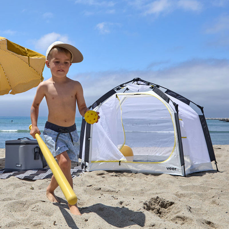 Little boy plays at the beach near Veer Basecamp Bundle - Basecamp / Air Pad / Adventure Tote - White / Gray