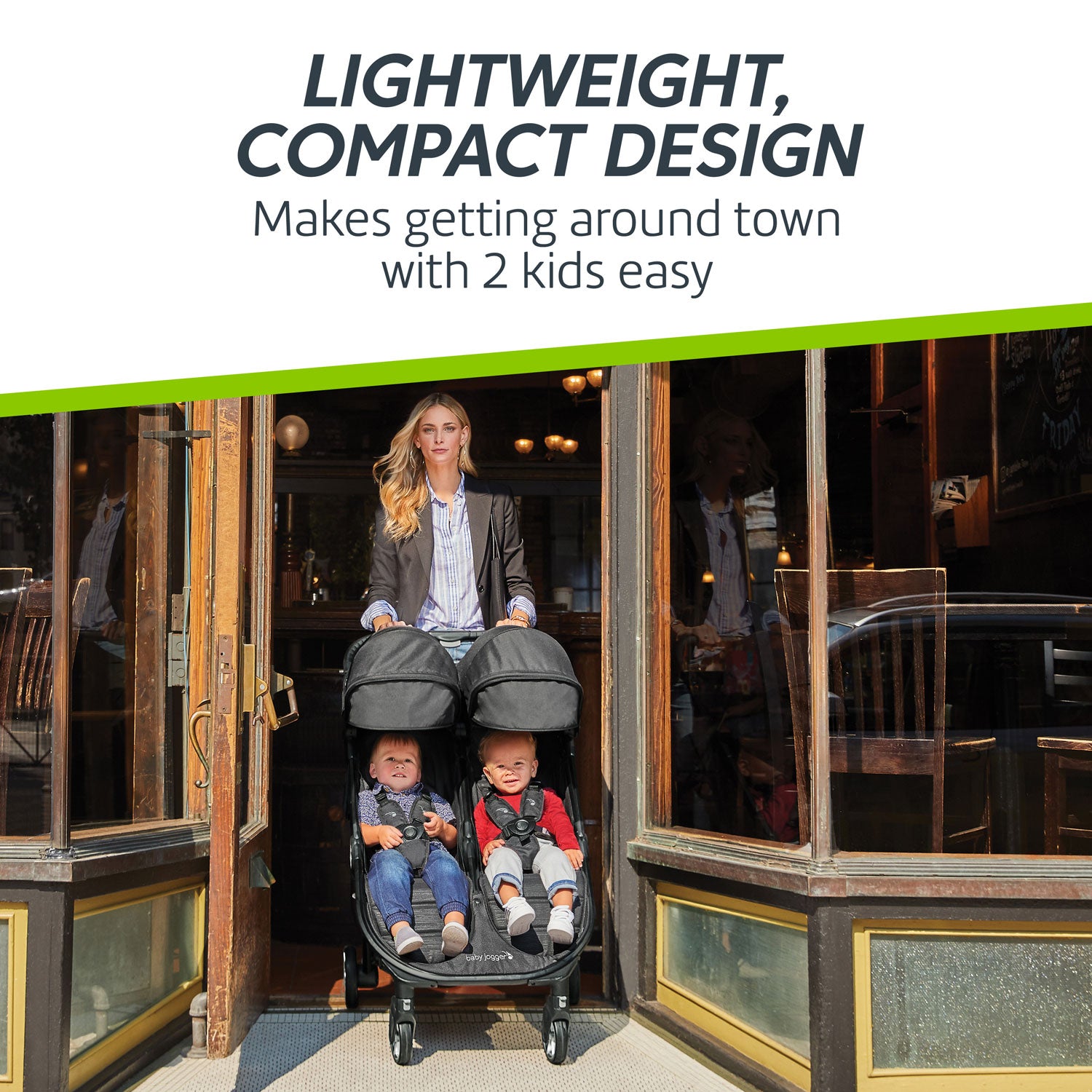 Woman pushes Baby Jogger City Tour 2 Double Stroller through doorway