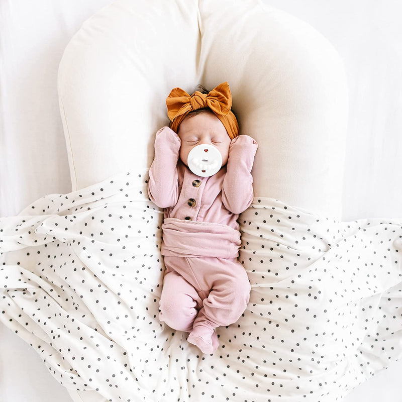 Newborn sleeping while sucking on Ryan and Rose Cutie PAT Kit - Neutral Kit
