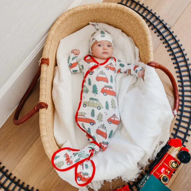 Baby wearing Copper Pearl Seasonal Newborn Knotted Gown - Griswold