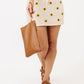 Woman holding Fawn Design Changing Clutch - Brown