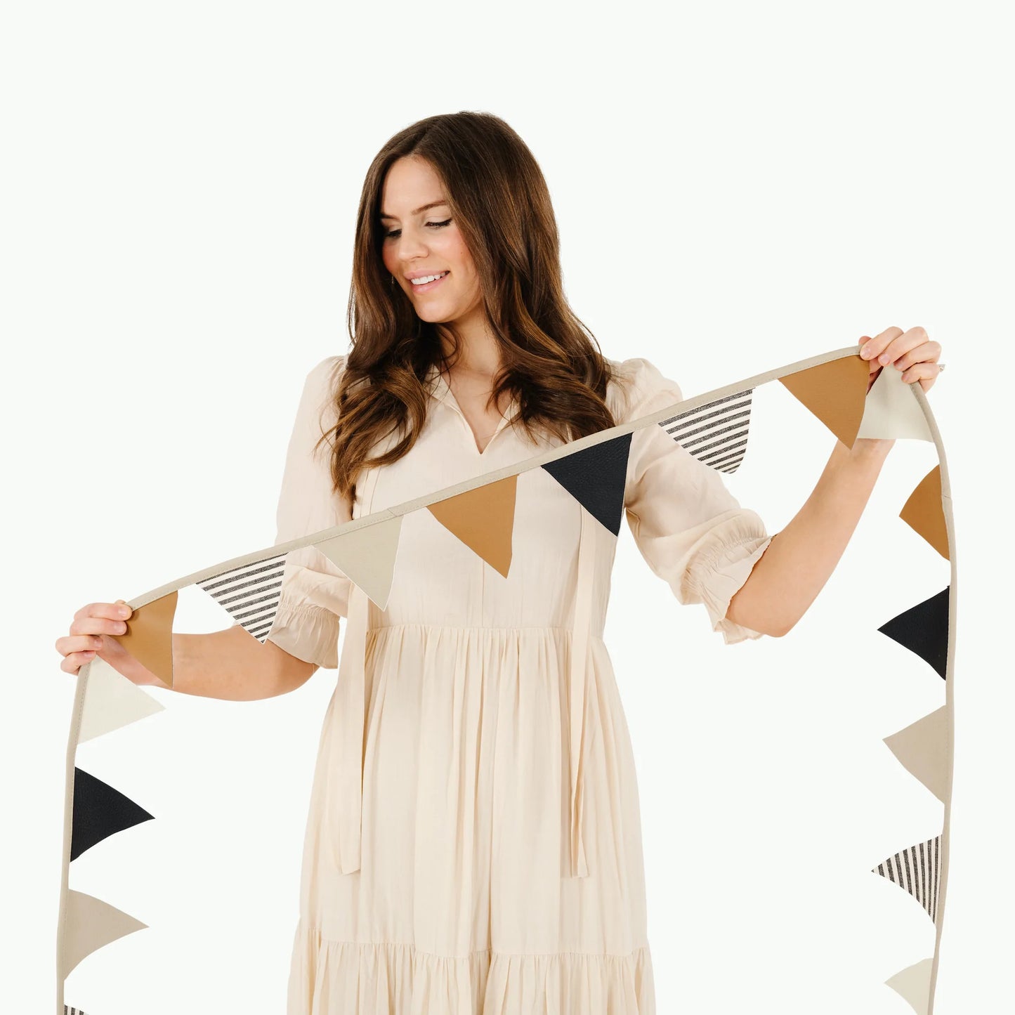 Woman holds Gathre Bunting Pennants - Stone Stripe