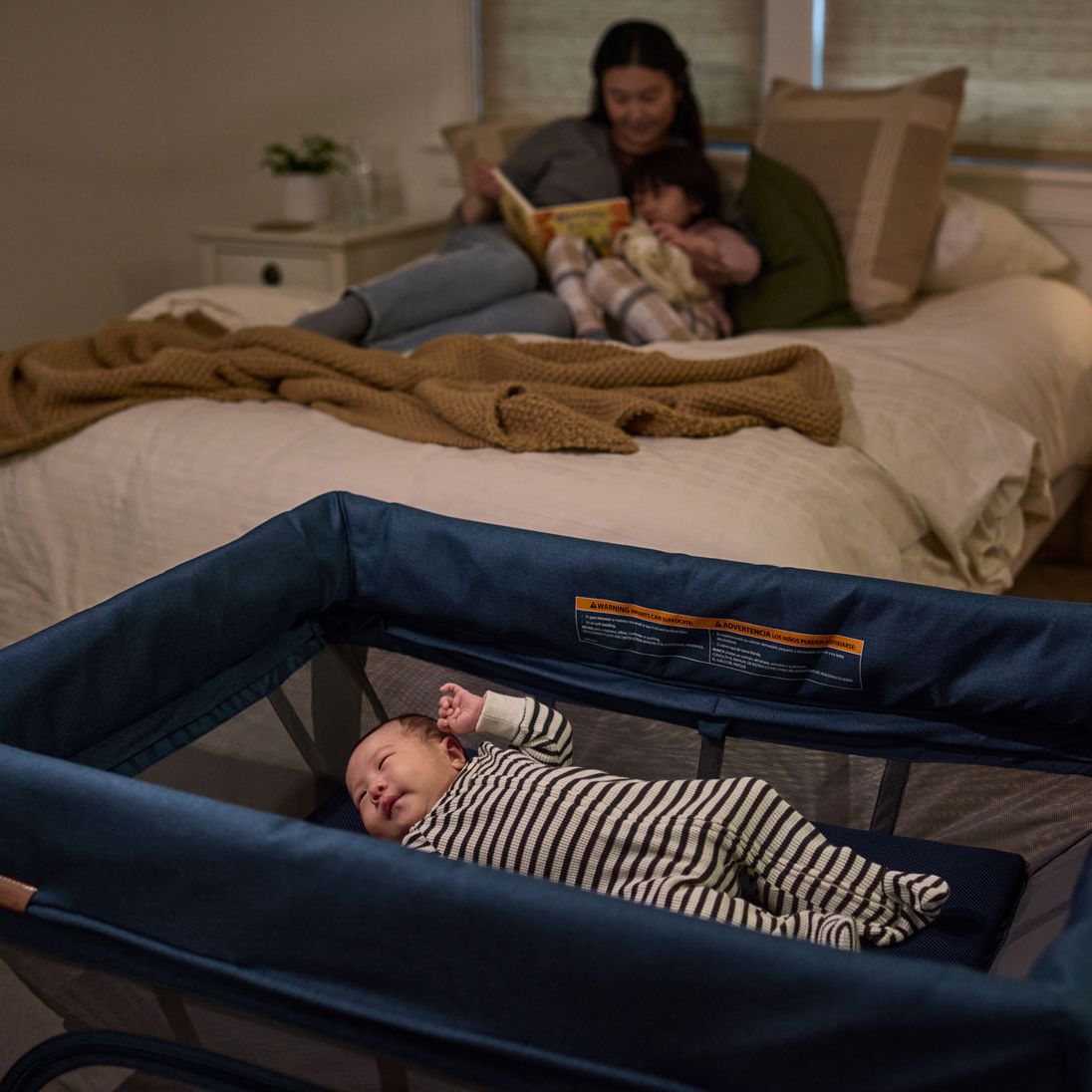 Baby asleep in UPPAbaby REMI Playard - Noa