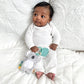 Baby Holding Itzy Ritzy Itzy Pal Infant Toy - Kayden the Koala