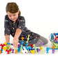 Child Playing with Fat Brain Toys Squigz Starter Set