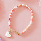 LittleLundsCo Baby Bracelet - Pink Coral Mix with White Heart Charm