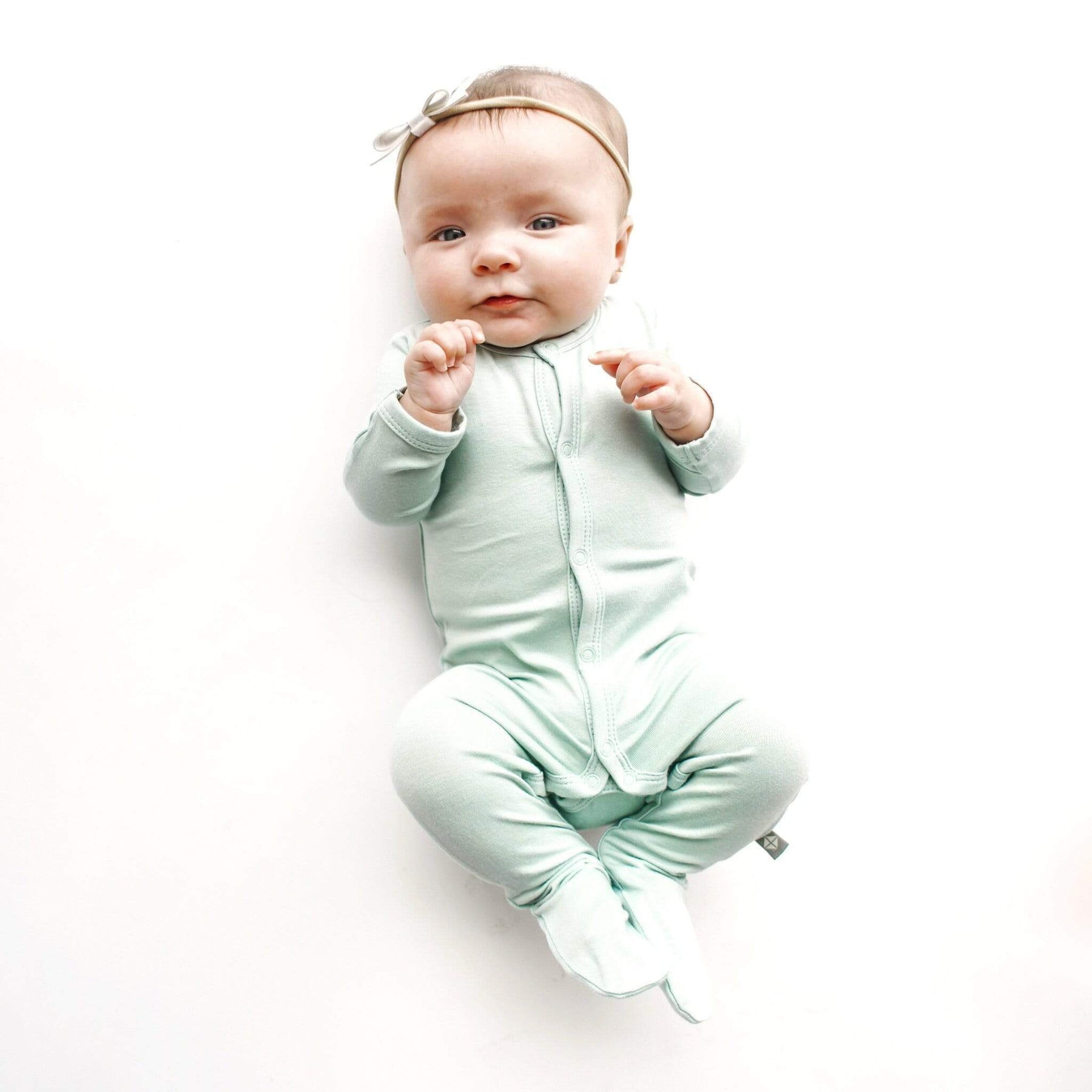 Baby wearing Kyte BABY Snap Footie - Sage